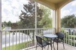 The screened in balcony allows you to enjoy the Florida breeze